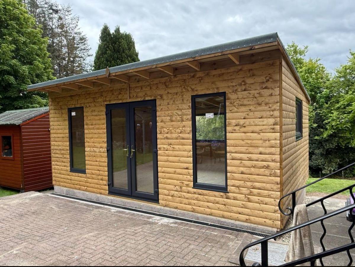 OD Garden Rooms timber-clad garden room with anthracite French doors and tall windows